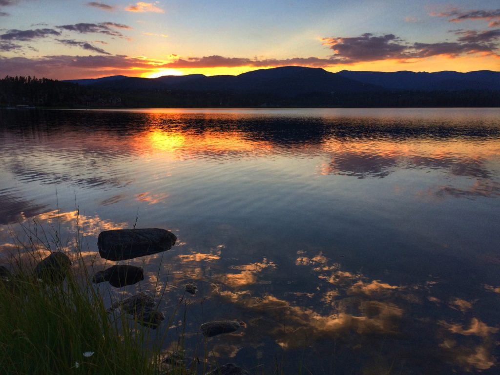 sunset golden red in the distance of a mountain lake