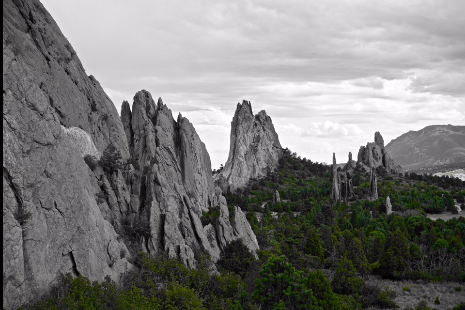 photo of green trees with black and white mountains in Garden of the Gods, Colorado